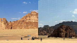 A facade with mirrors showing the landscape