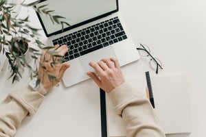 Hand on laptop touchpad