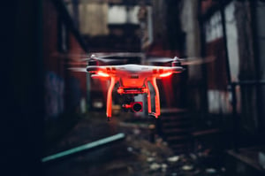 Drone flying over a cityscape, capturing high-resolution video and data for public safety operations
