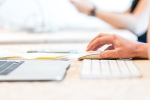 a close up of a hand working with a mouse on a computer
