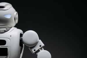 A close cutout of the shoulder and parts of the head of a white robot on dark background