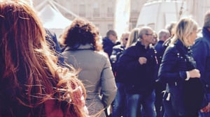 a close-up of a crowd in a city in the sun