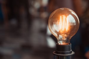 a close up of a light bulb producing orange light